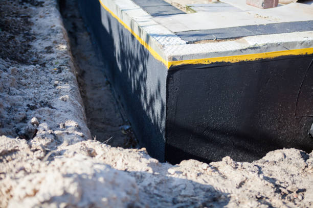 Professional Basement Waterproofing technician working in Genoa, IL